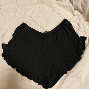 Brandy Melville flowy shorts in dark grey/black